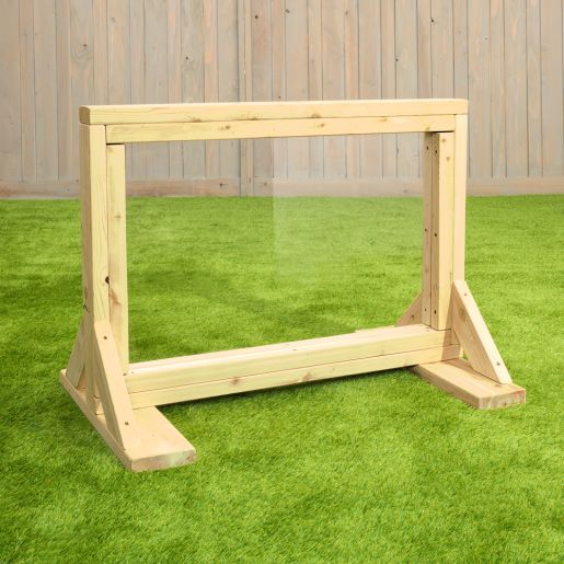 Infant Art Easel with a natural Western Red Cedar frame and clear acrylic drawing panel, displayed on grass.