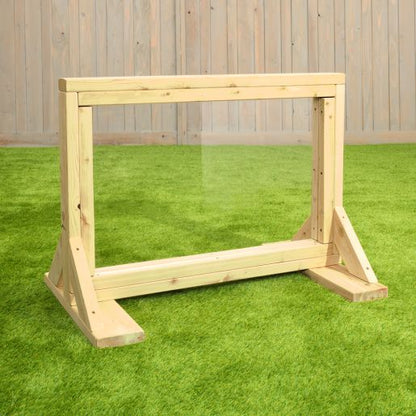 Infant Art Easel with a natural Western Red Cedar frame and clear acrylic drawing panel, displayed on grass.