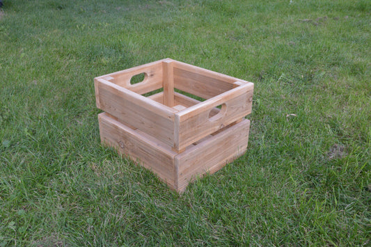 Large outdoor cedar box with integrated handles displayed on grass
