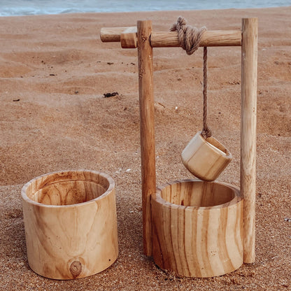Wooden water well with bucket for hands-on outdoor water play